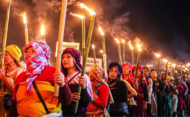 Protesters clash with police during torch rally in Manipur